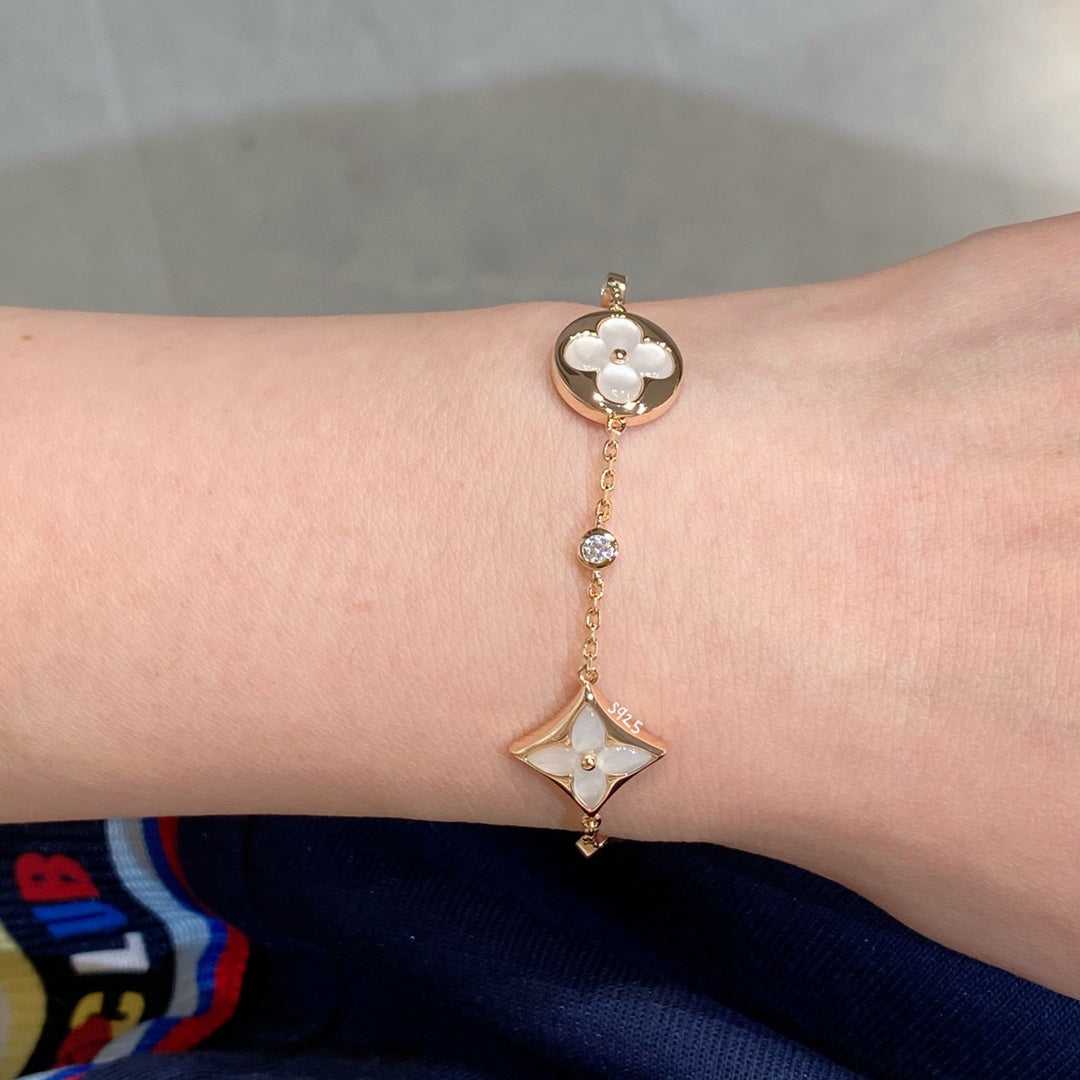 Mystic STAR AND SUN 4 MOTIF WHITE MOP PINK GOLD BRACELET