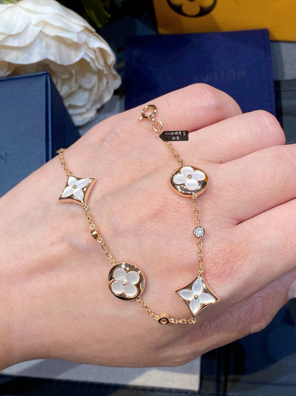 Mystic STAR AND SUN 4 MOTIF WHITE MOP PINK GOLD BRACELET